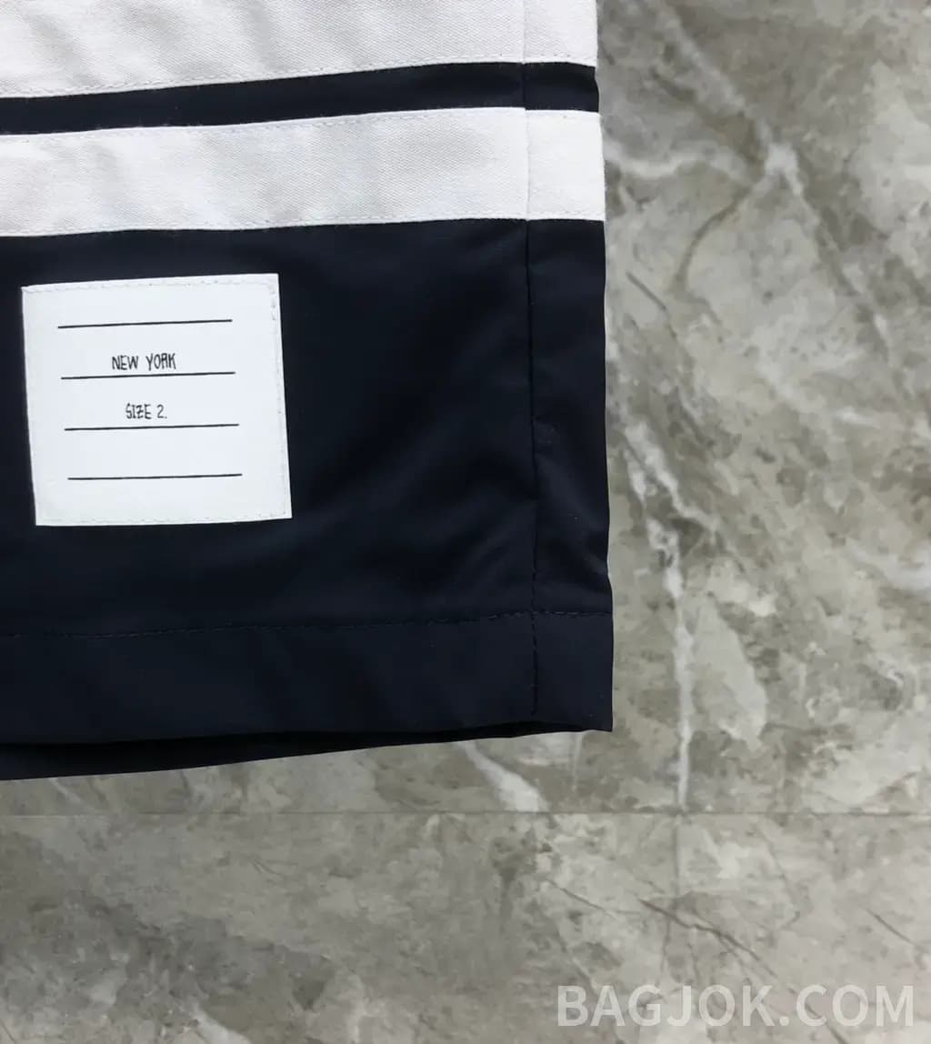 톰브라운 톰브라운 시그니처 삼색 스트라이프 나일론 스윔 쇼츠 상세 이미지